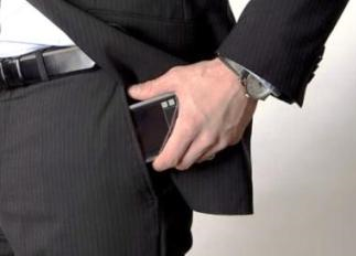 mobile phone in trouser pocket